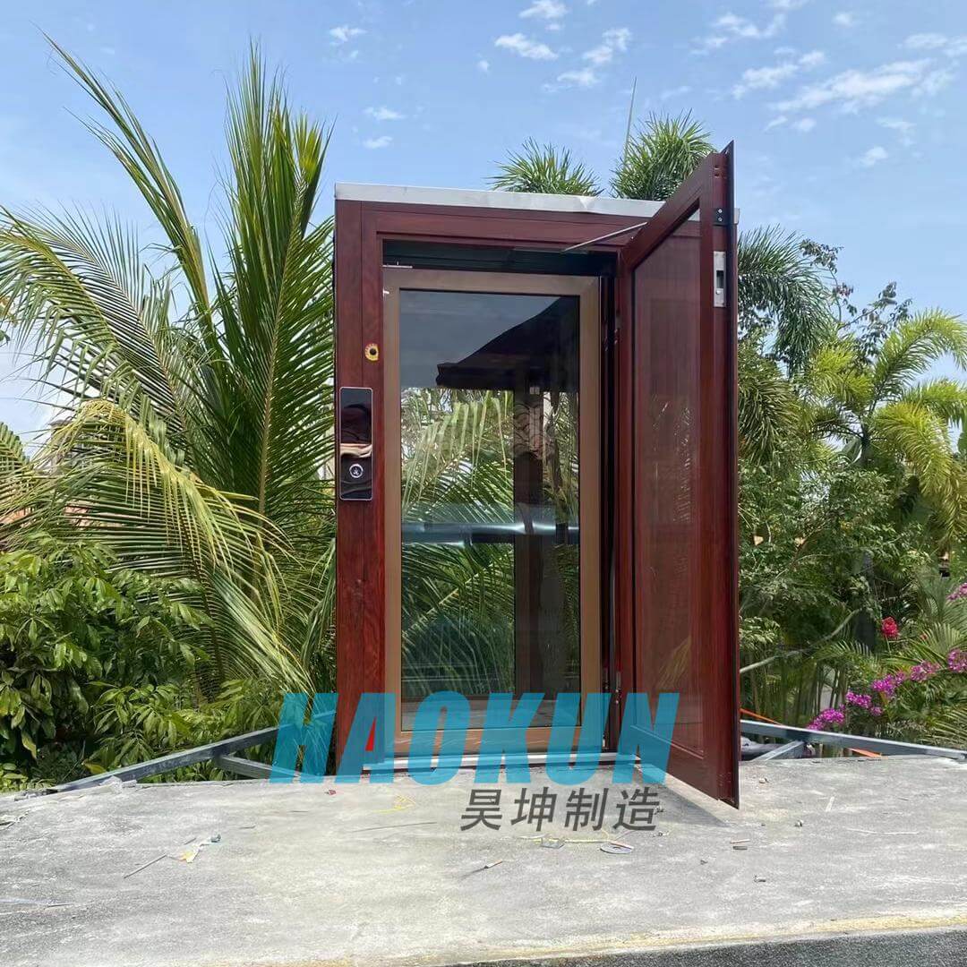 Outdoor hydraulic home elevator with glass sightseeing shaft installed on a rooftop terrace